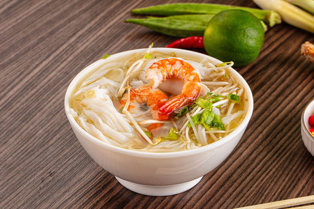 Vietnamese soup Pho with seafood - prawn