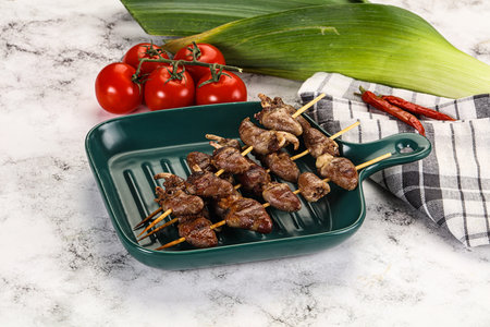 Gourmet Grilled chicken hearts skewer in the plateの写真素材