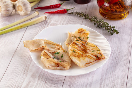Fresh grilled calamari protein with herbs