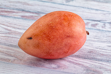 Whole ripe sweet tropical red mango fruit