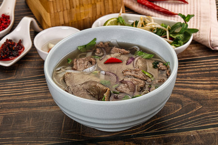 Vietnamese Pho Bo soup with beef, noodles, cilantro and spices