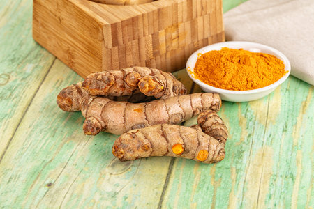 Fresh aroma turmeric roots heap served powder