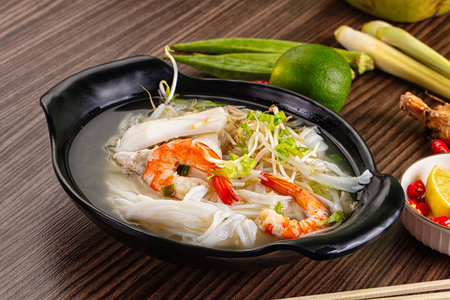 Vietnamese soup Pho with seafood - prawn