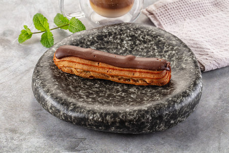 Gourmet chocolate eclair with brown icingの写真素材