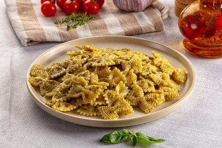 Italian green pasta farfalle with pesto basil sauceの写真素材