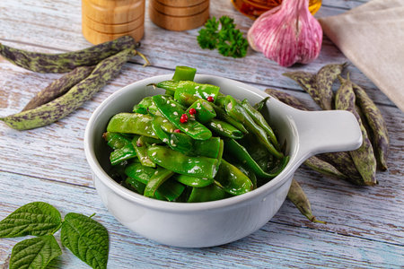 Steamed green bean strings heap with olive oil