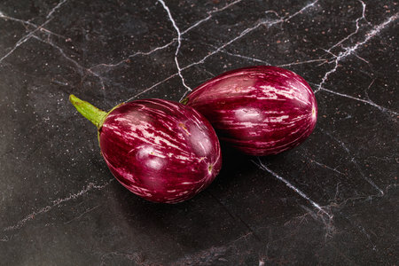 Ripe raw mini violet eggplant for cookingの写真素材