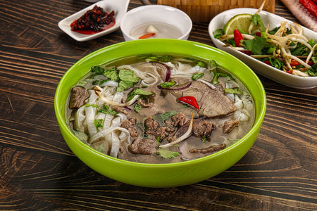 Vietnamese Pho Bo soup with beef, noodles, cilantro and spices