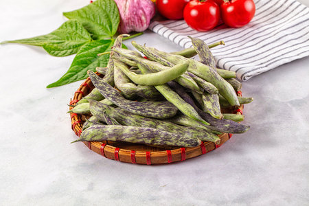 Raw green bean strips heap in the bowl