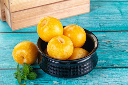 Raw ripe sweet yellow plums fruitの写真素材