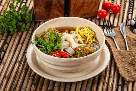 Korean kuksi soup with noodles and meat