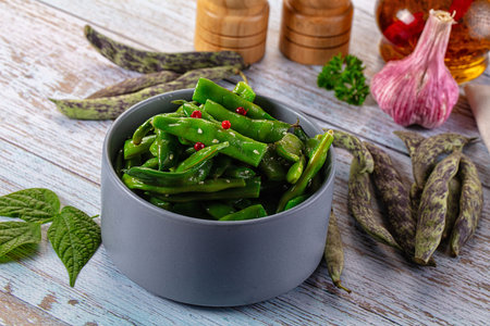 Steamed green bean strings heap with olive oil