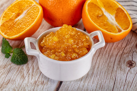 Sweet homemade orange jam in the bowlの写真素材
