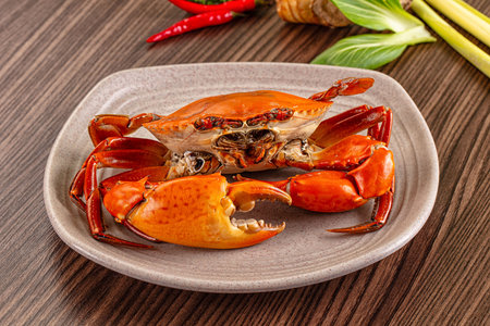 Gourmet Steamed orange wild crab in the plateの写真素材