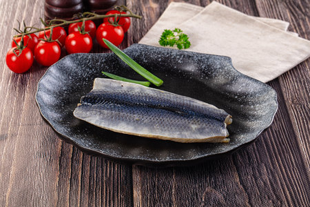 Salted herring marinated fillet with skinの写真素材