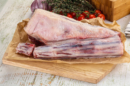 Raw beef oxtail for cooking over wooden boardの写真素材