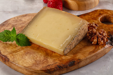 Gourmet hard aged yellow cheese piece