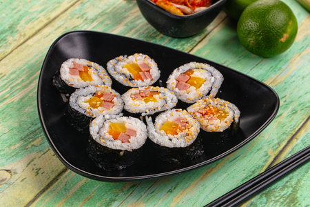 Homemade roll Kimbap with nori seaweed, sausages and vegetables