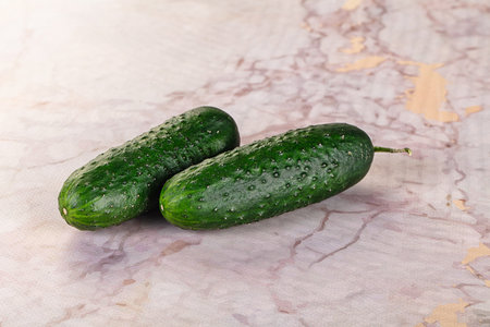 Ripe green raw two cucumbers for snackの写真素材