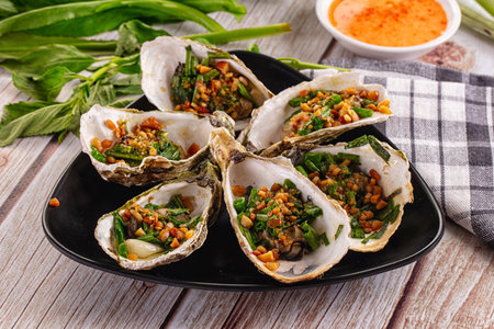 Grilled oysters with green onion and peanut