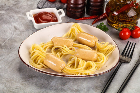 Dietary baby chicken sausage with spaghetti and sauceの写真素材