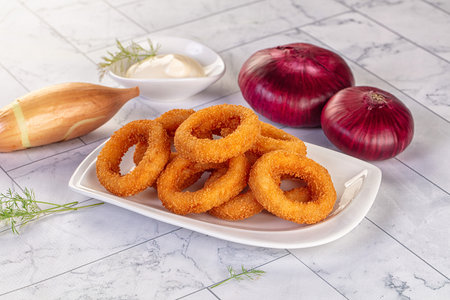 Golden fried breaded onion rings snack
