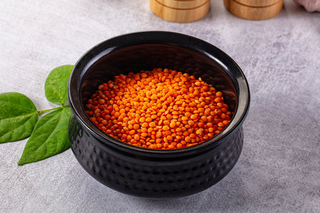 Raw dry red lentil in the bowl for coocking