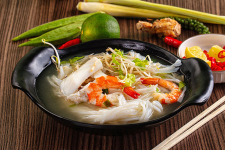 Vietnamese soup Pho with seafood - prawn and calamari