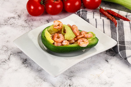 Dietary avocado cut with prawn and lemon juiceの写真素材