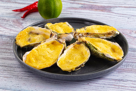 Plate of Baked oyster with parmesan cheeseの写真素材
