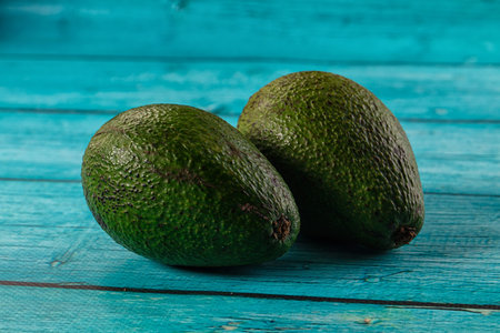 Raw ripe green juicy avocado tropical fruitの写真素材