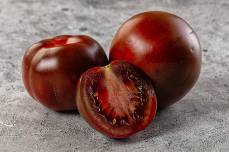 Raw juicy sweet dark tomato Kumatoの写真素材