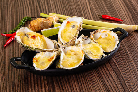 Gourmet baked oysters with parmesan cheeseの写真素材