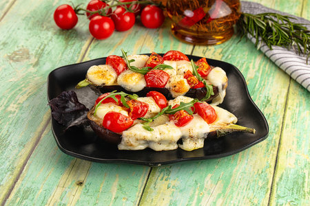 Baked eggplant with cherry tomato and mozzarella cheeseの写真素材