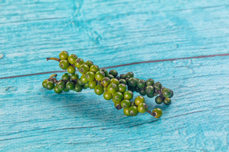 Ripe green pepper corn branch for cookingの写真素材