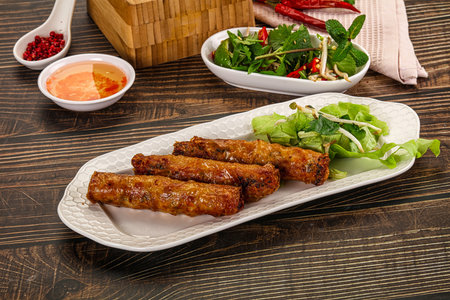 Fried Vietnamese stuffed spring roll with special sauceの写真素材