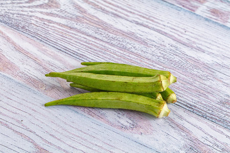 Raw organic green okra vegetable for vegan cuisineの写真素材