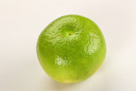 Green ripe fruit sweetie citrus over backgroundの写真素材