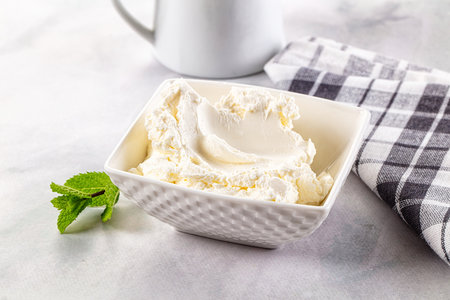 Cream cheese in the bowl served mintの写真素材