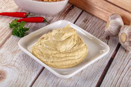 Natural organic homemade chickpea hummus in the bowl