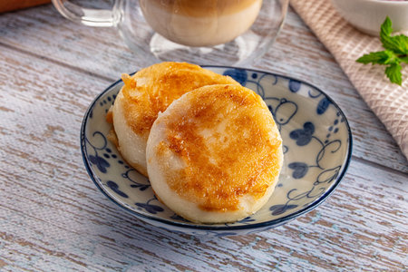 Fried homemade cottage cheese syrniki for breakfast