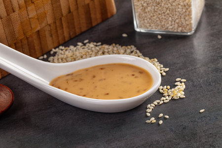 Asian sesame sauce dip with seeds for salad