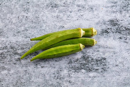 Raw organic green okra vegetable for vegan cuisineの写真素材