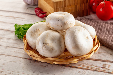 Raw white champignon mush heap for cookingの写真素材