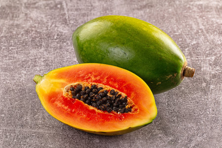 Fresh sweet juicy green papaya with cutの写真素材