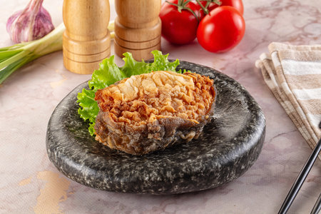 Roasted cod fish fillet piece in the plate