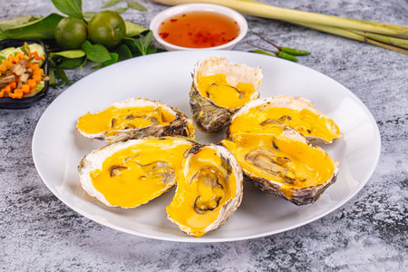 Baked hot oyster with cheddar cheeseの写真素材