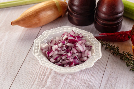 Diced fresh red onion in the bowlの写真素材
