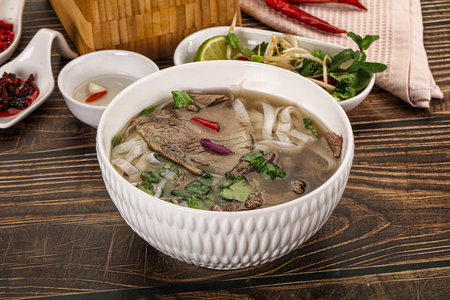 Vietnamese Pho Bo soup with beef, noodles, cilantro and spices