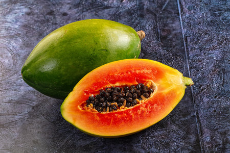 Fresh sweet juicy green papaya with cutの写真素材